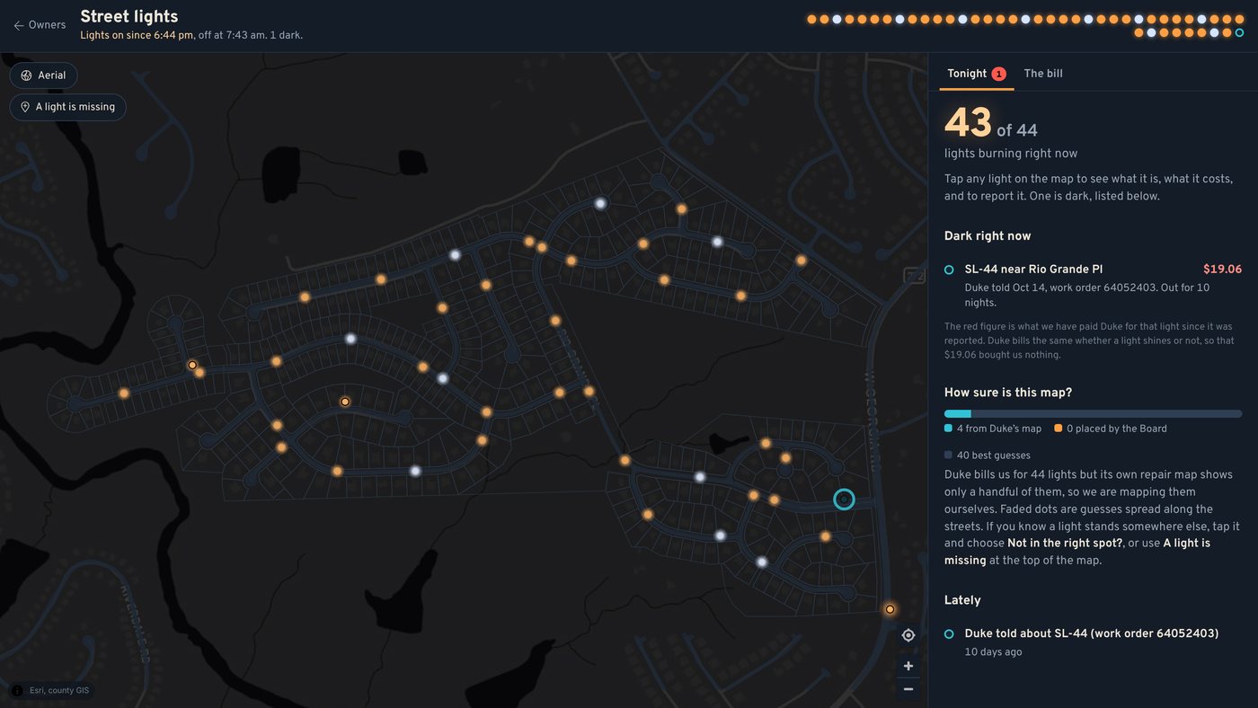 The night map: orange sodium lights and white metal halide lights along our streets, with one dark light circled in teal